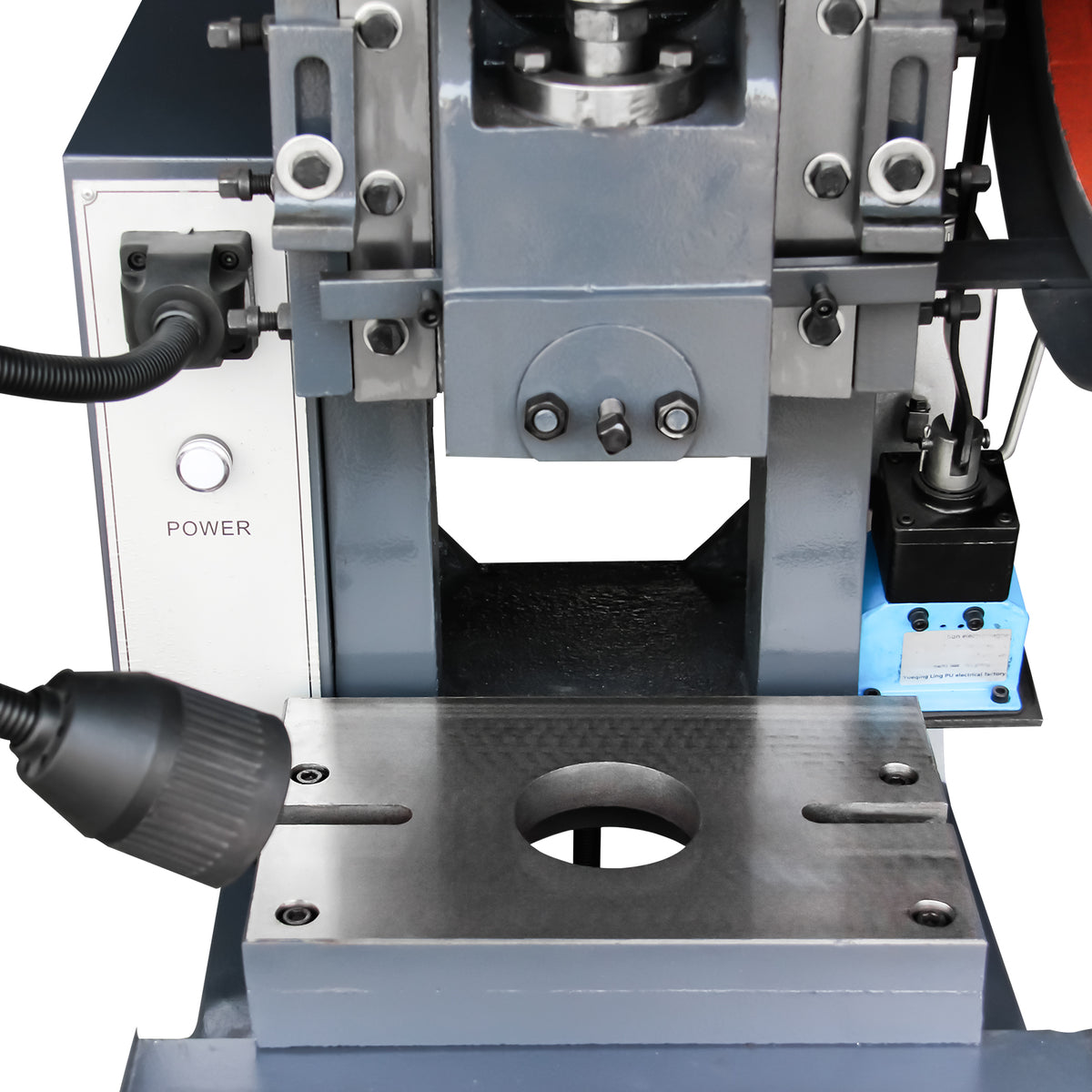 Close-up of the 10-Ton OBI punch press stamping area featuring a flexible work light and sliding guide rails, model JB23-10