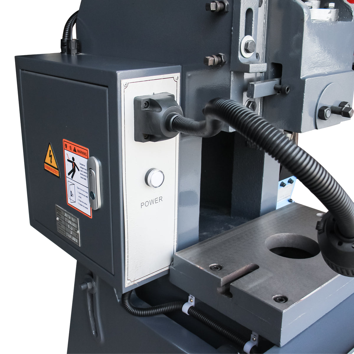 Side view of the mechanical punch press power control box with warning stickers, power button, and work light attachment, model JB23-10