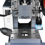 Close-up of the 10-Ton OBI punch press stamping area featuring a flexible work light and sliding guide rails, model JB23-10
