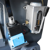Close-up of the mechanical punch press oil lubricator and blue solenoid valve mechanism for continuous lubrication, model JB23-10